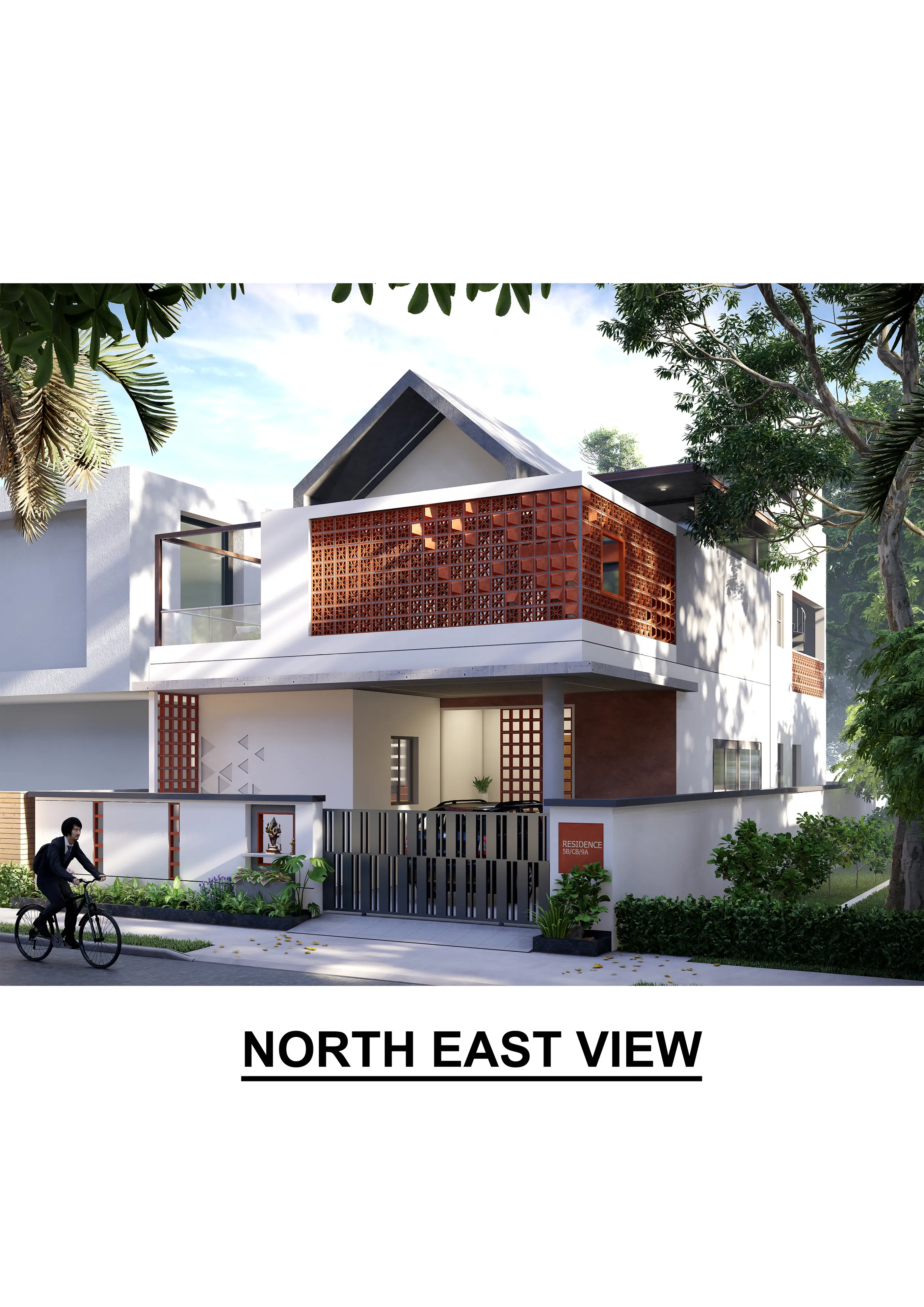 White gabled house with a full-width terracotta jali screen across the first-floor balcony, seen through street trees