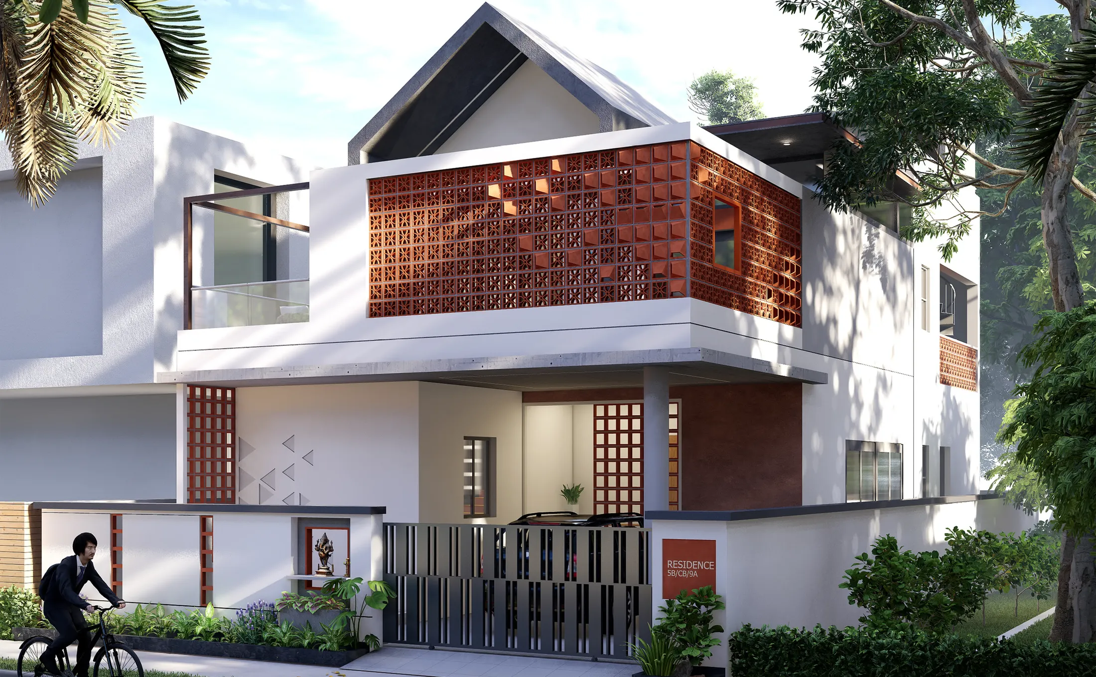 White gabled house with a full-width terracotta jali screen across the first-floor balcony, seen through street trees