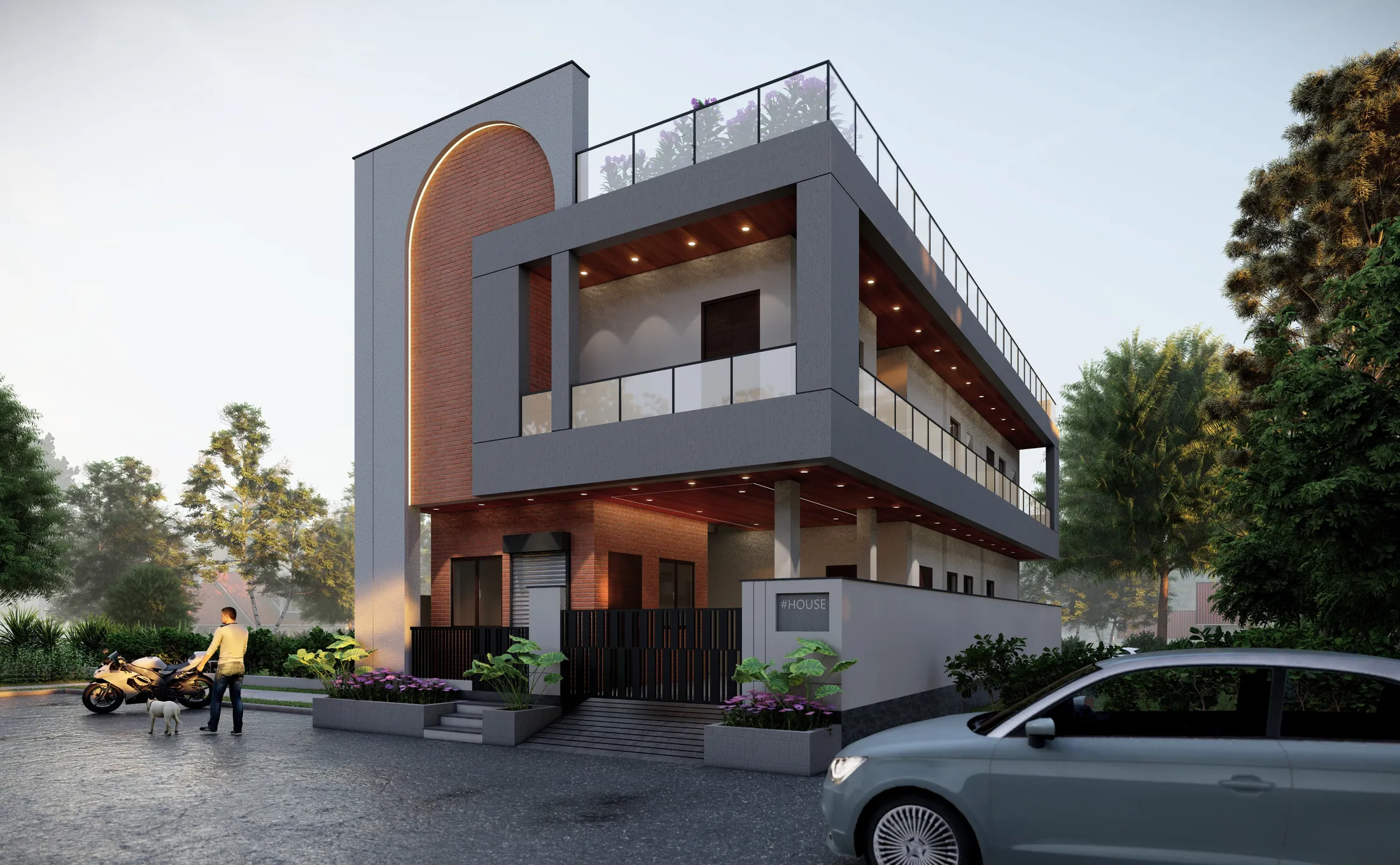 Dusk view of Residence-05 — a grey two-storey home with a tall brick arch, layered balconies, and warm lighting behind a planted compound wall