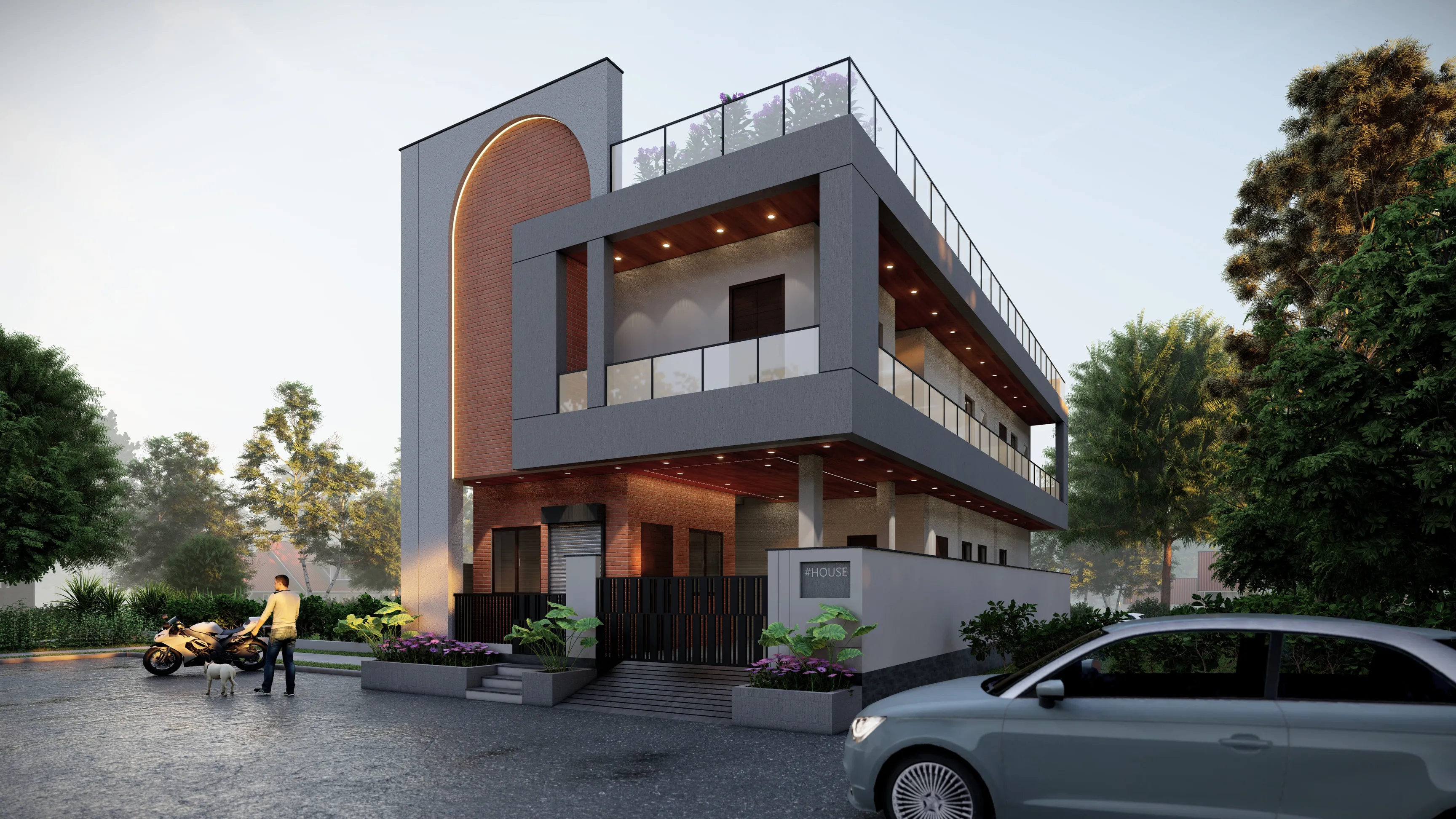 Dusk view of Residence-05 — a grey two-storey home with a tall brick arch, layered balconies, and warm lighting behind a planted compound wall