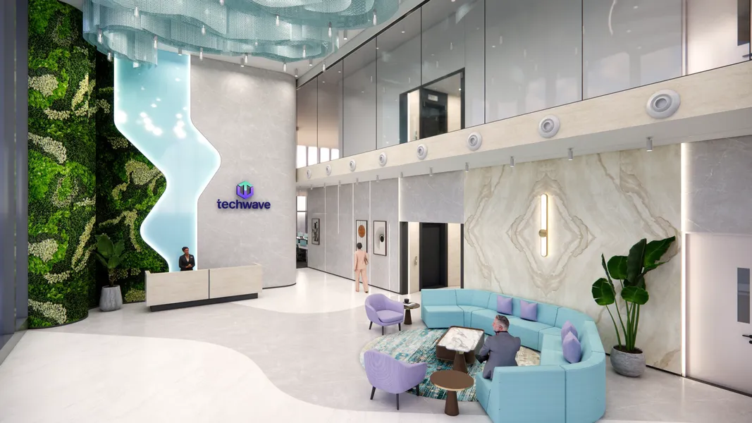 Double-height lobby with a living green wall, cascading blue water feature, and reception desk